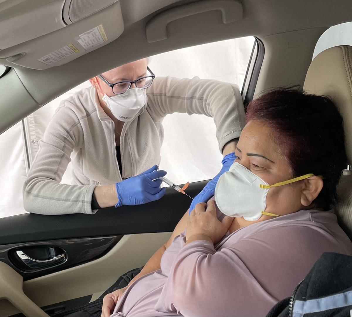 Dr. Zita Konik vaccinates Dolores Hernandez.jpg