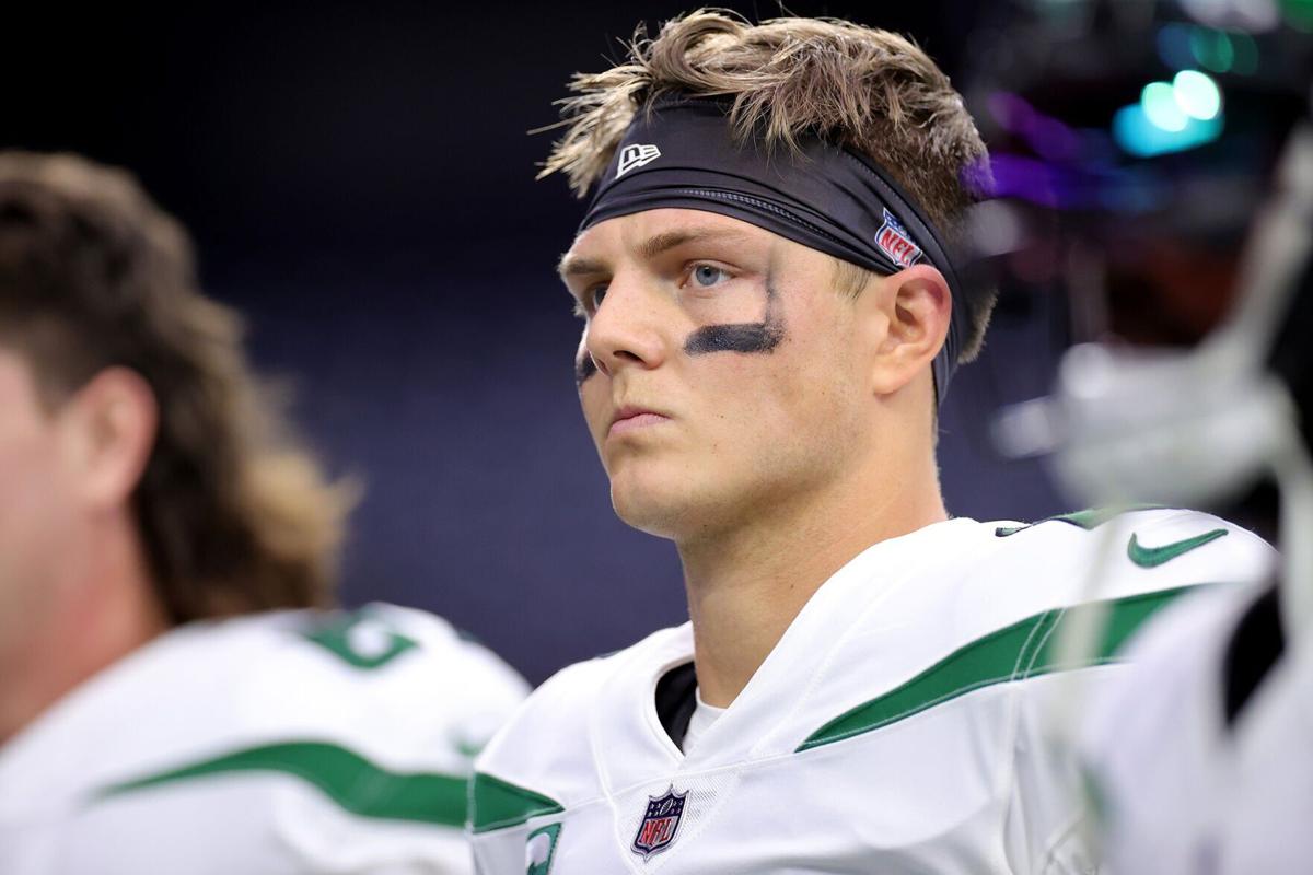 Zach Wilson of the New York Jets looks on before the game against the Houston Texans at NRG Stadium on November 28, 2021 in Houston, Texas.