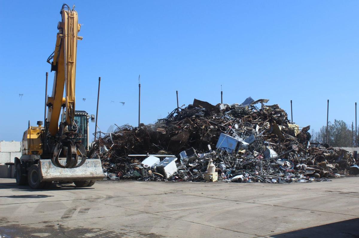 Crane sorts garbage at Clover Flat