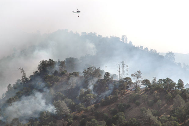 Firefighters hold line on flames, but Monticello Fire remains a threat