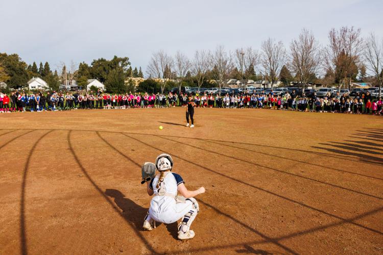 Softball players at local Little Leagues don pro league's team names,  jerseys