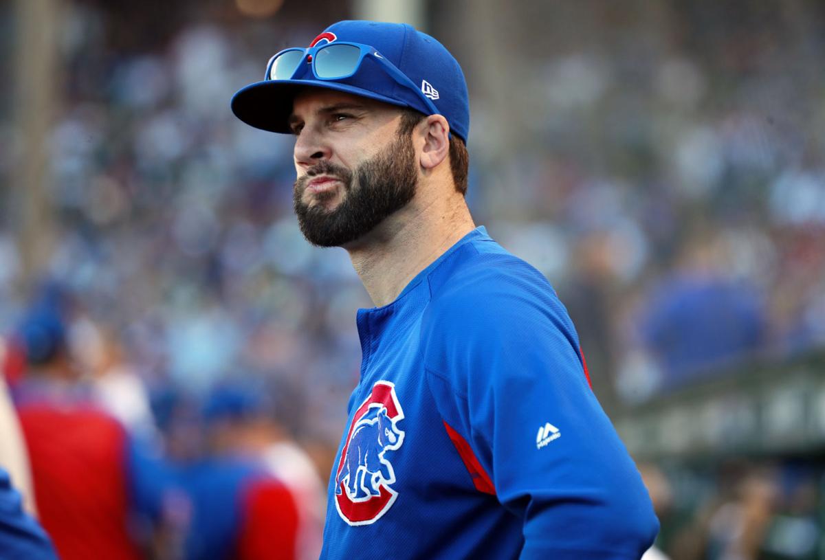 Cubs relief pitcher Brandon Morrow stands in the dugout during a game against the Reds on Sept. 15, 2018. \n