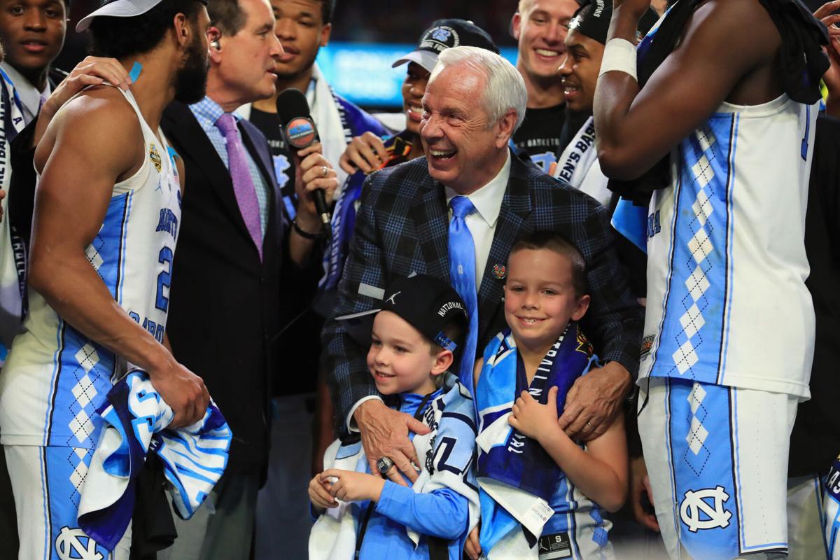 Head coach Roy Williams of the North Carolina Tar Heels celebrates with his team and grandchildren after defeating the Gonzaga Bulldogs during the 2017 NCAA Men's Final Four National Championship game at University of Phoenix Stadium on April 3, 2017 in Glendale, Arizona.