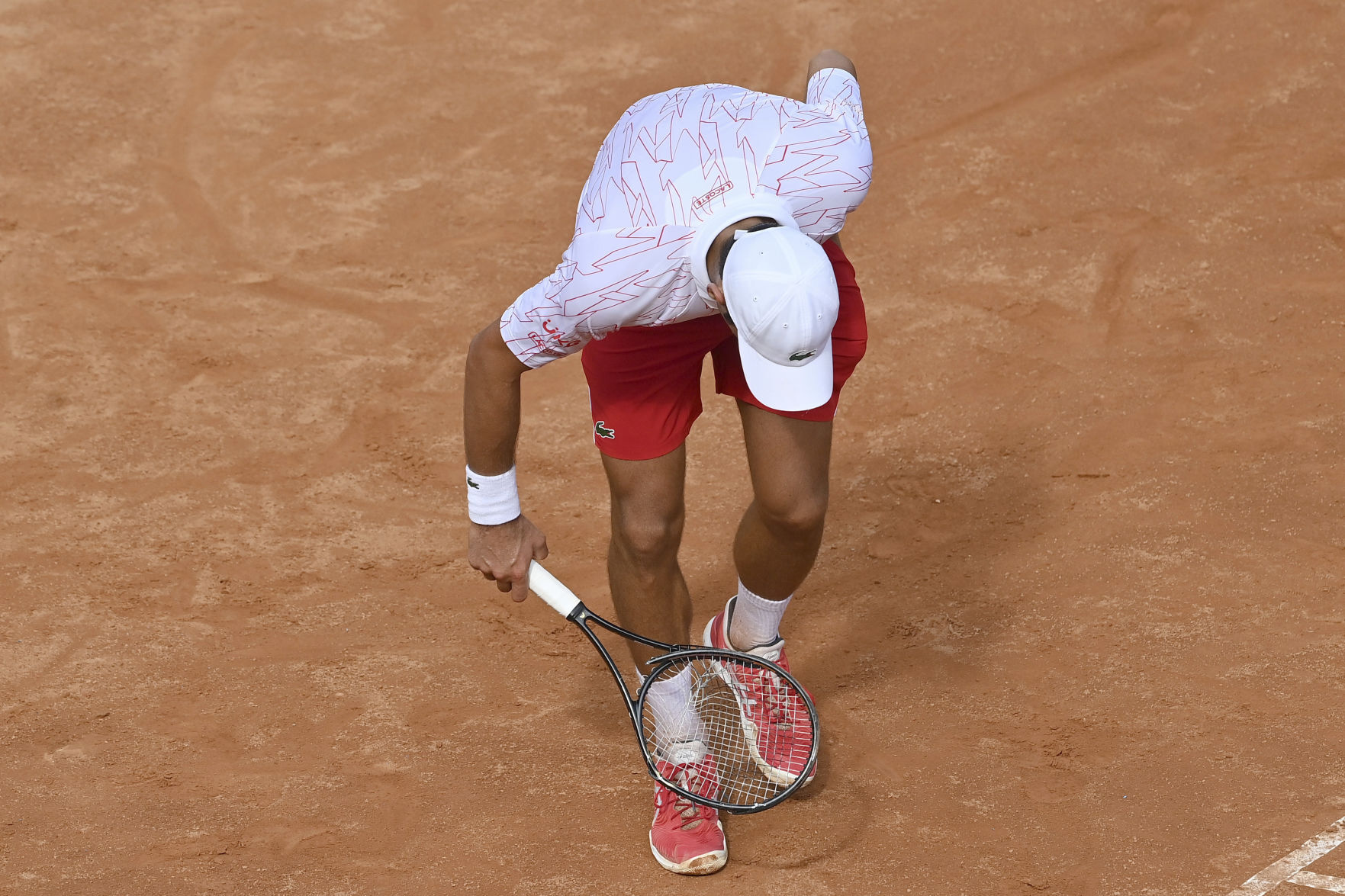 tennis player breaks racket