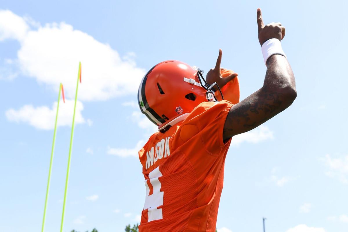 Deshaun Watson of the Cleveland Browns celebrates as he walks onto the field during Cleveland Browns training camp at CrossCountry Mortgage Campus on July 30, 2022, in Berea, Ohio.