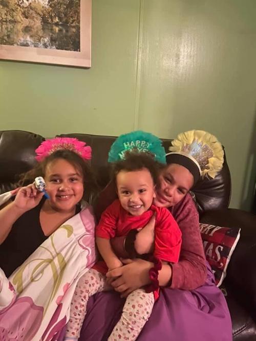 Megan Levin's children smile in a family photo.