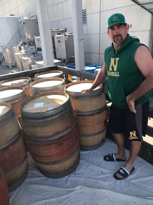 Dan Parker with wine barrels