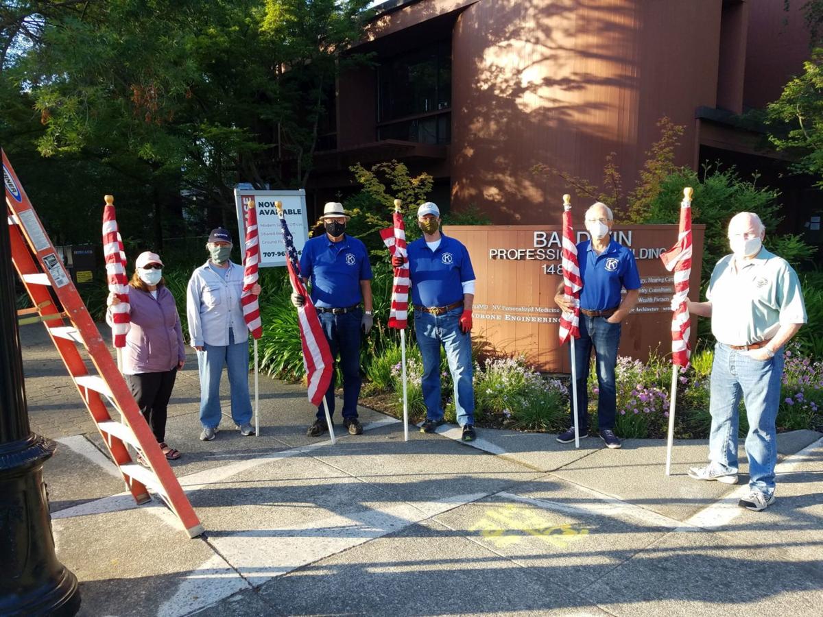 Kiwanis Club hangs flags
