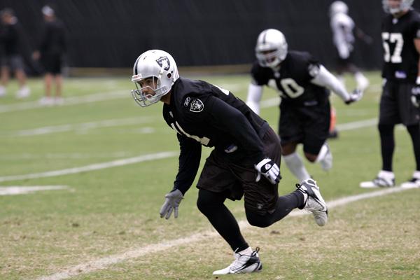 TYLER BRAYTON & WARREN SAPP OF THE OAKLAND RAIDERS DEFENSE…