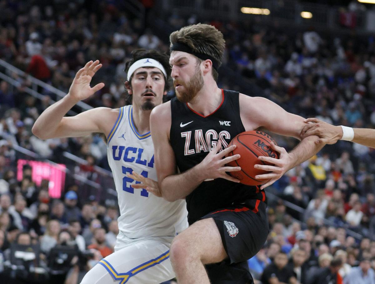 Gonzaga's Drew Timme drives against UCLA's Jaime Jaquez Jr. during the championship game of the Good Sam Empire Classic at T-Mobile Arena on Tuesday, Nov. 23, 2021, in Las Vegas.