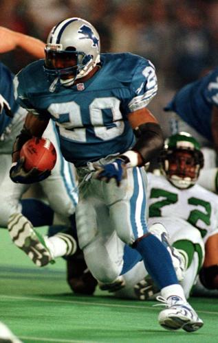 1997: Barry Sanders becomes third player to rush for 2,000 yards in a season