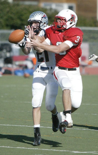 Varsity Football: Justin Siena pounds Redwood High School