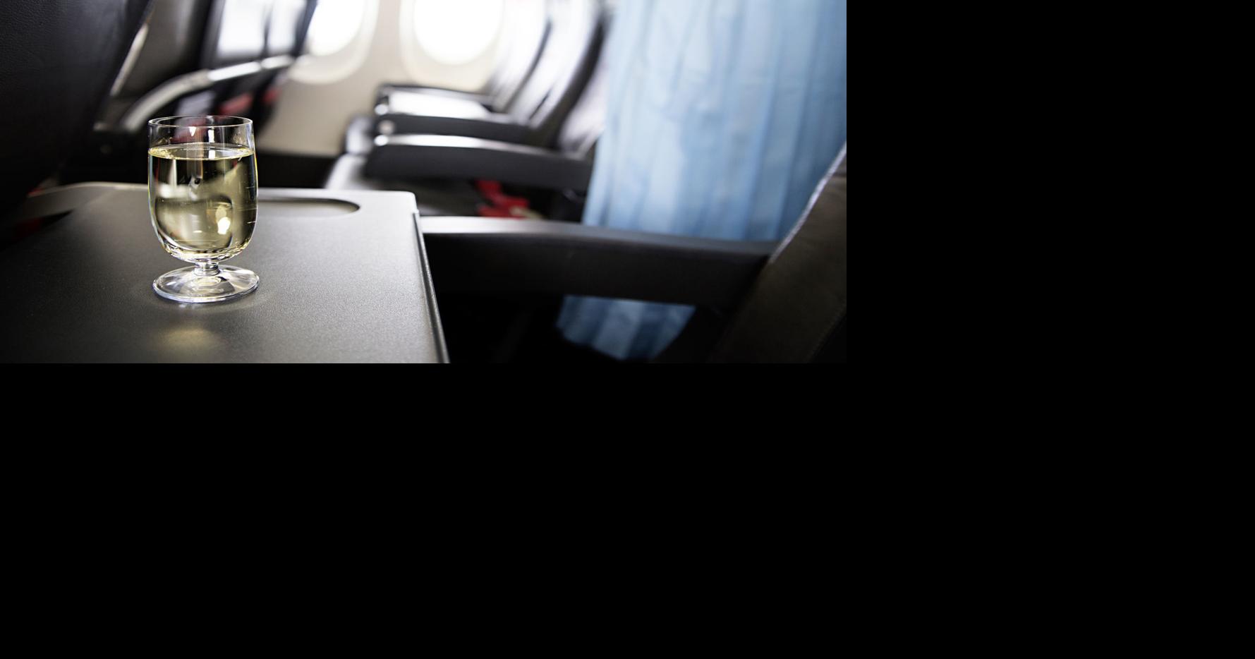 Here's what you need to know about alcohol on planes