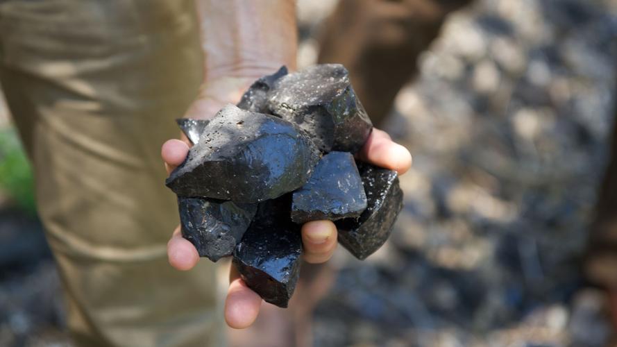 Obsidian Rock in Hand