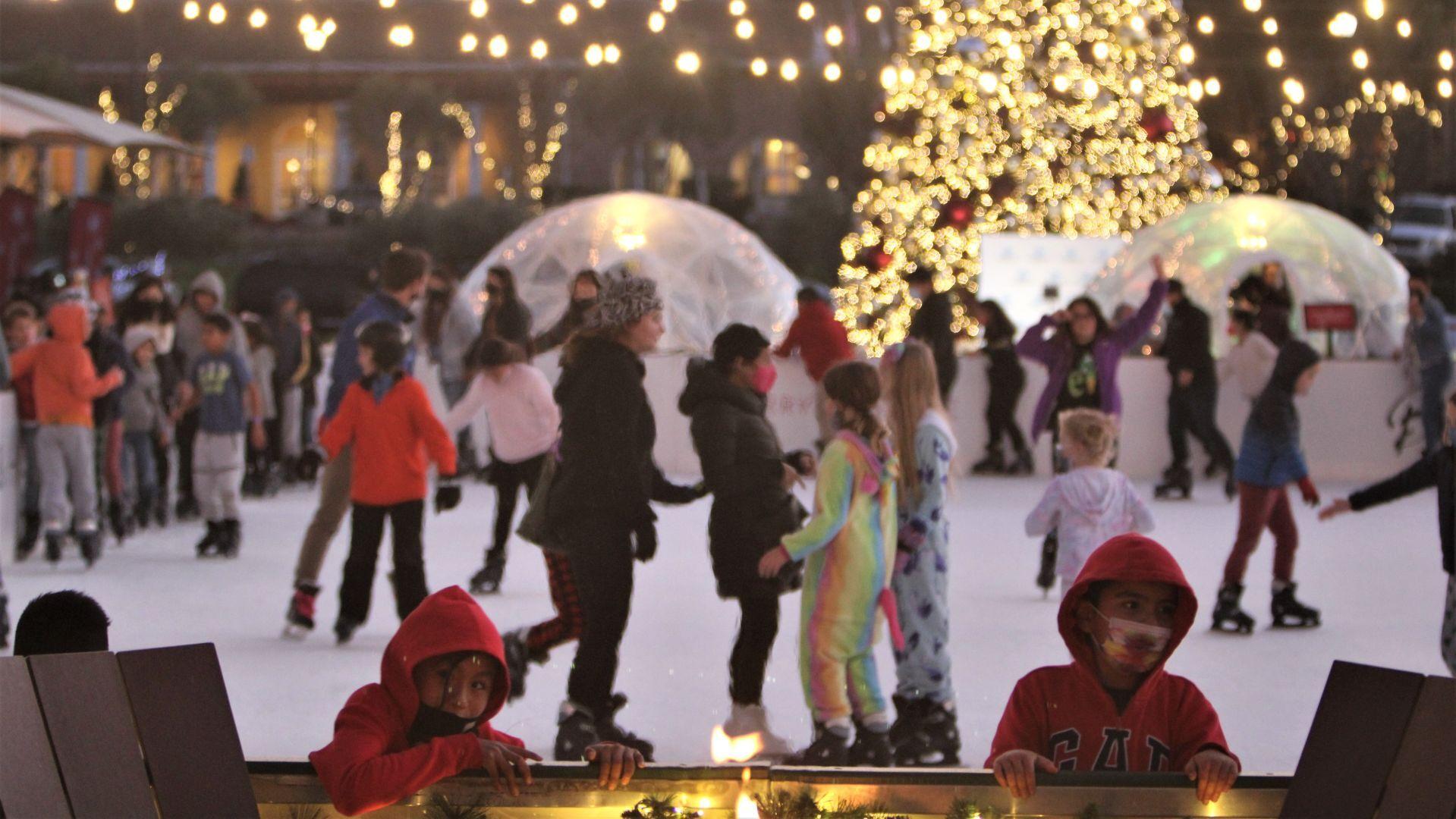 Meritage ice skaters with tree and globes