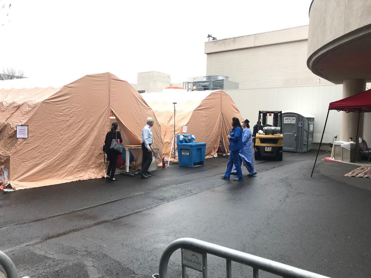 Queen coronavirus triage tents