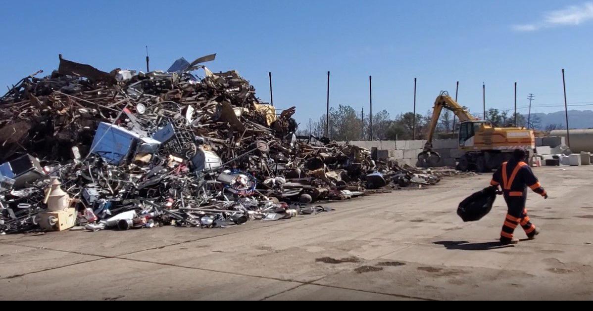 Crane sorts trash at Clover Flat Landfill