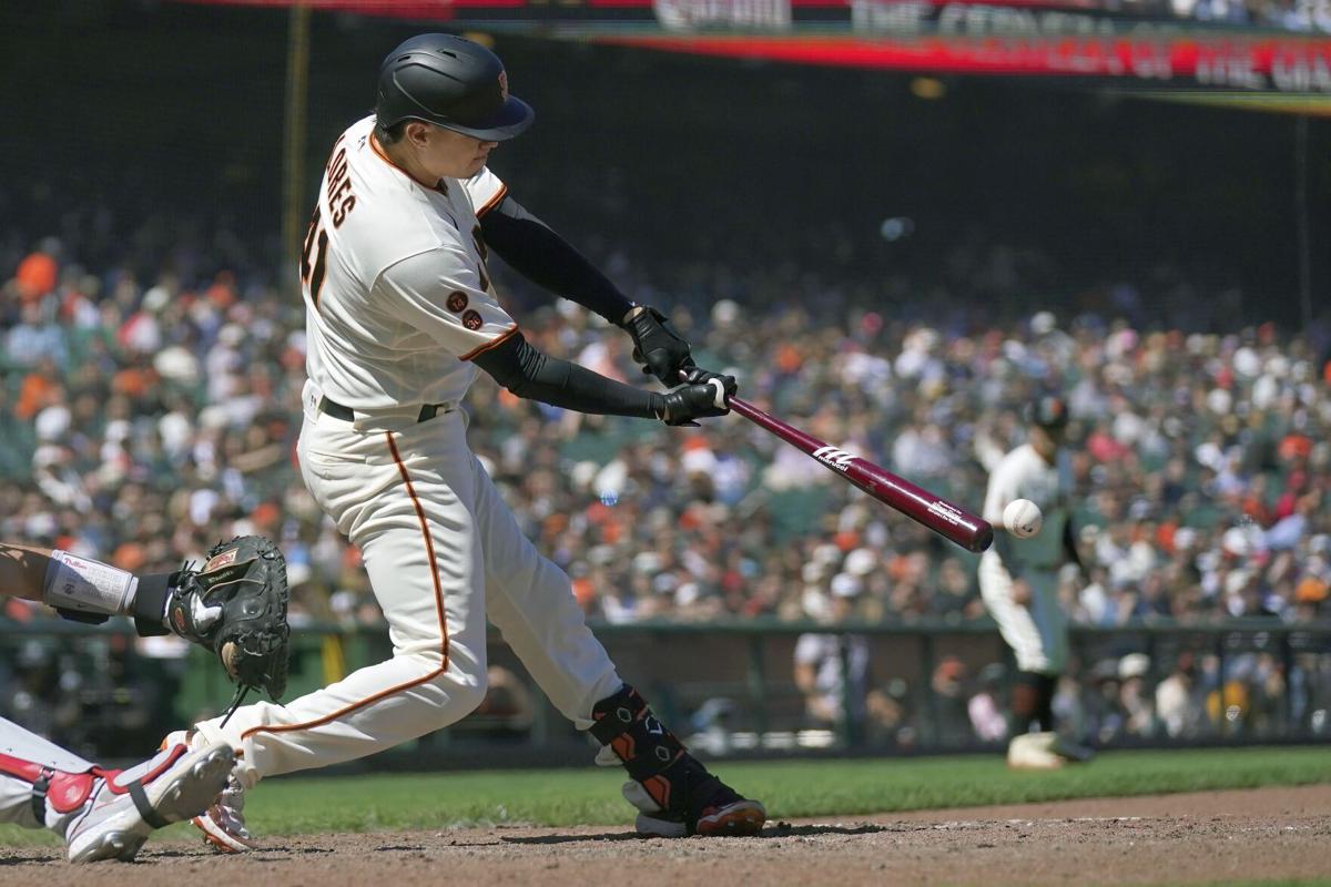 San Francisco Giants left fielder MITCH HANIGER hits an RBI single