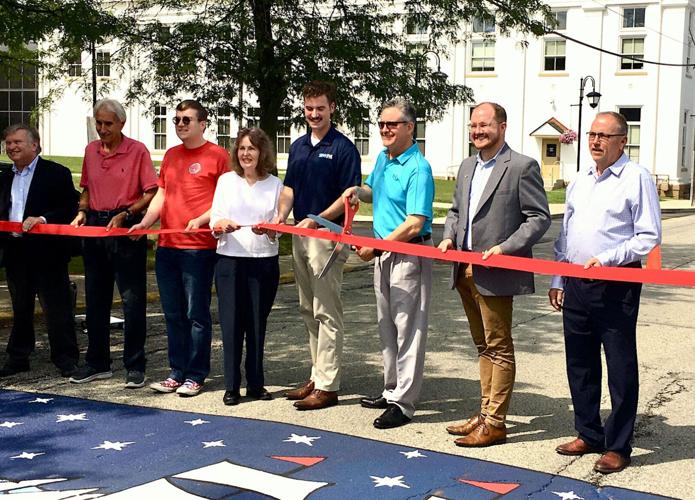 Participants cut ribbon for street mural | Local News | ncnewsonline.com