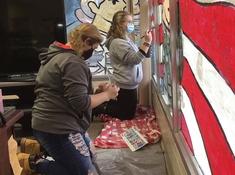 Shenango students paint veterans mural on Legion windows