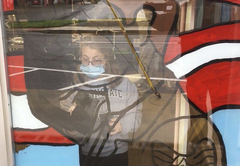 Shenango students paint veterans mural on Legion windows
