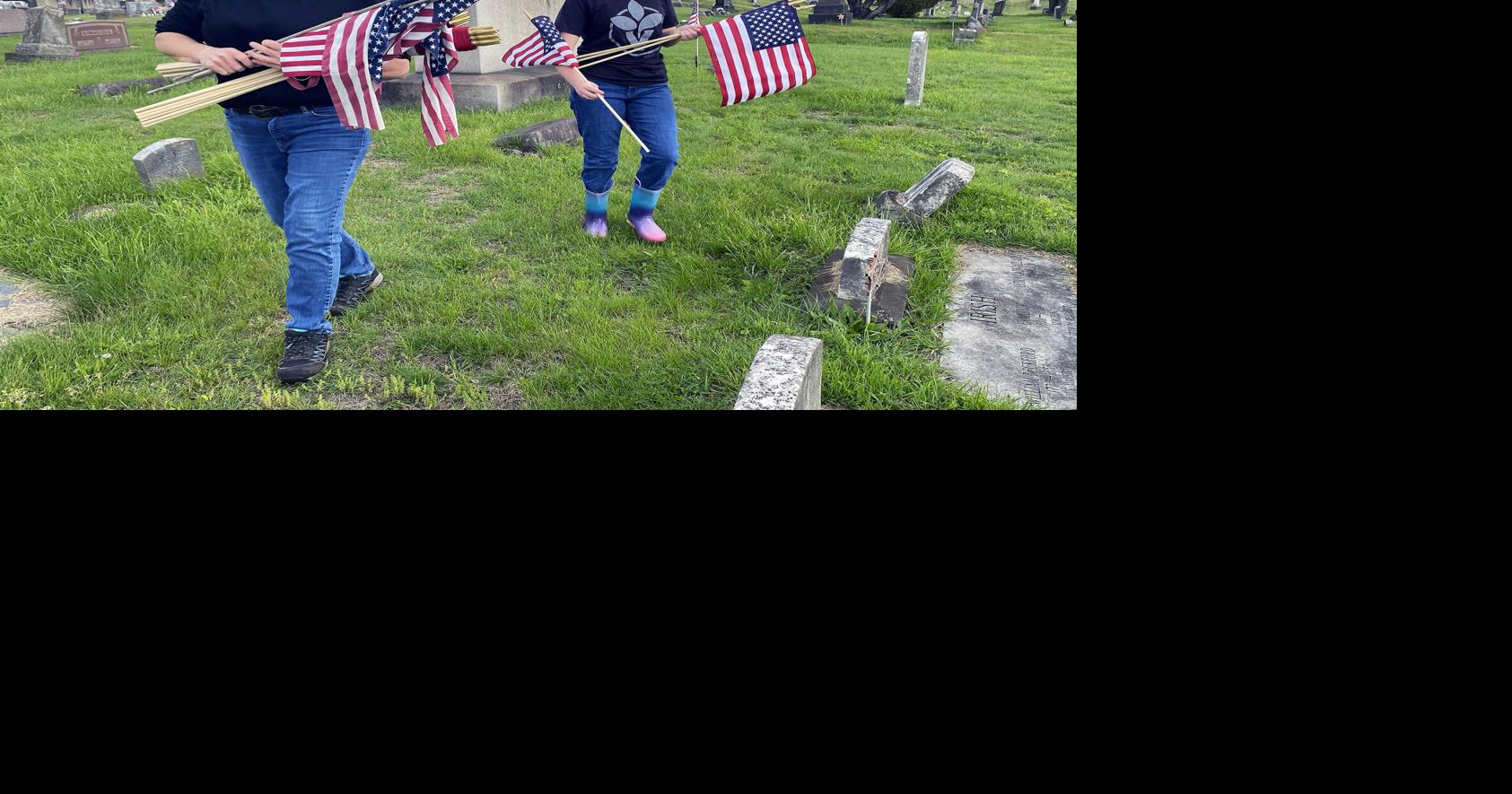 Volunteers place flags at near-pristine Greenwood
