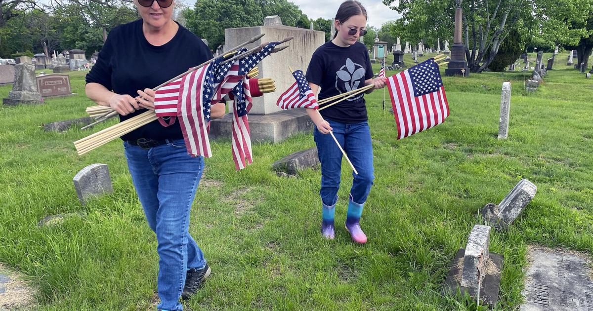 Volunteers place flags at near-pristine Greenwood