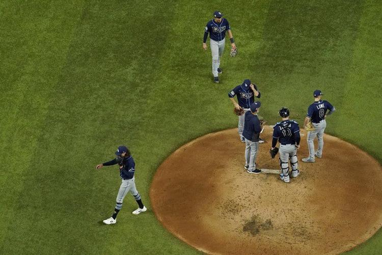 Tampa Bay Rays starting pitcher Tyler Glasnow wipes his face after