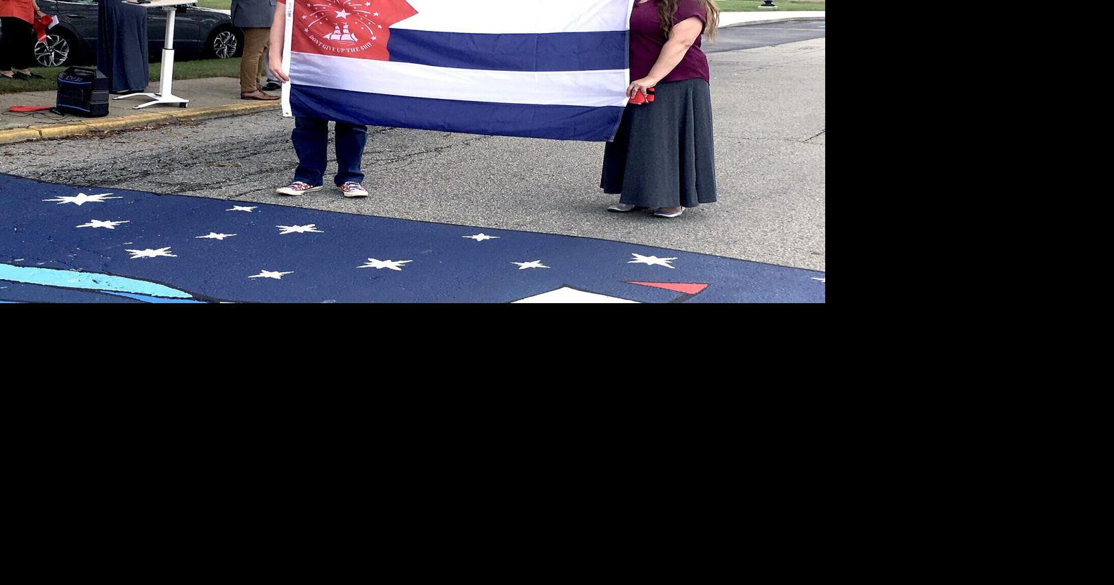Participants cut ribbon for street mural | Local News | ncnewsonline.com