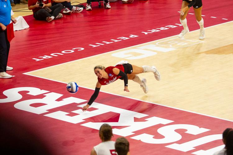 VOLLEYBALL: Laney Choboy lays out for a dig