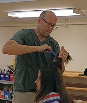 Adopt-a-Student Program: Backpacks, haircuts for returning students