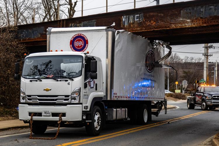 Driver cited after getting truck stuck under North Chapel Street bridge ...