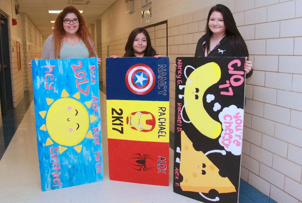 Leaving their mark Newark High seniors decorate ceiling tiles to honor