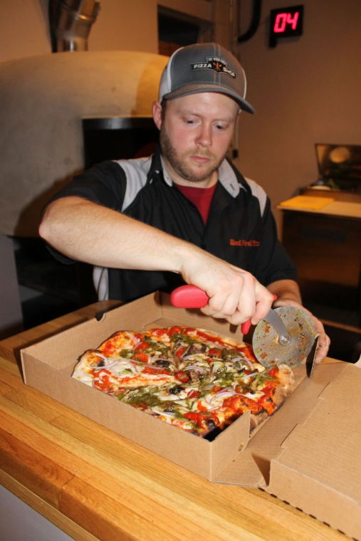 From wheels to walls Wood Fired Pizza moves inside News