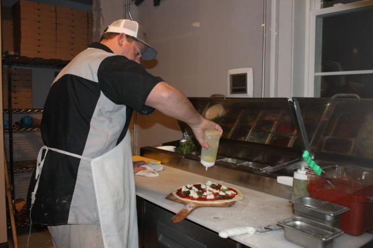 From wheels to walls Wood Fired Pizza moves inside News