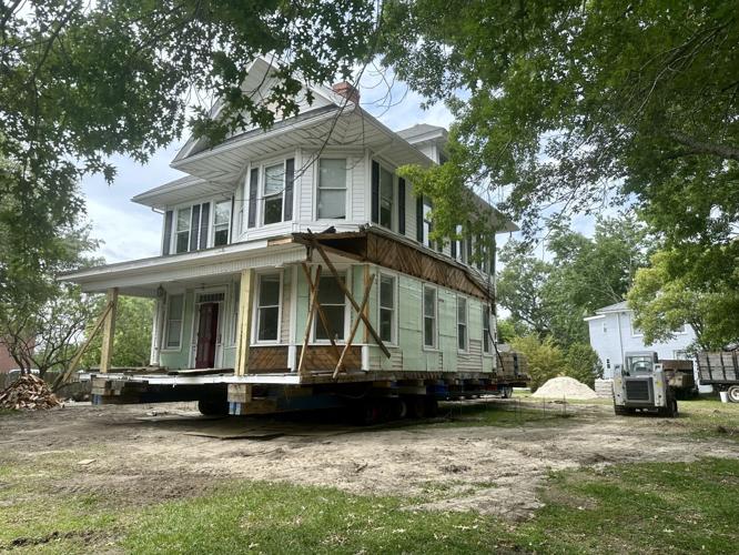 Workers move 600,000 pound Tisdale House from Broad Street to begin