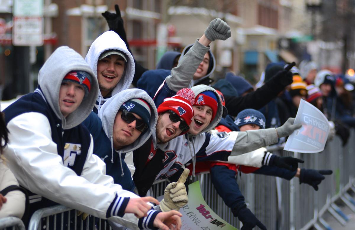 Patriots fans line Boylston Street nearly an hour before the parade to celebrate the team's Super Bowl win begins.