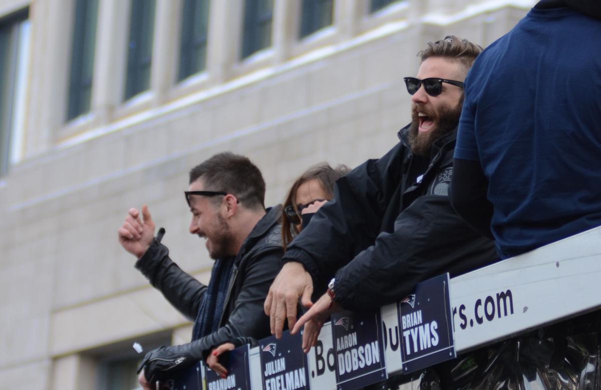 Patriots Wide Receivers Julian Edelman, right, and Danny Amendol, left, laugh and cheer with the crowd during the team's celebratory parade down Boylston Street.