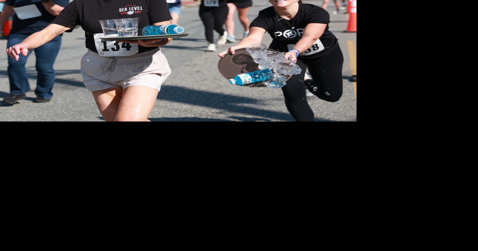 Local waitstaff take part in Waiter and Waitress Race