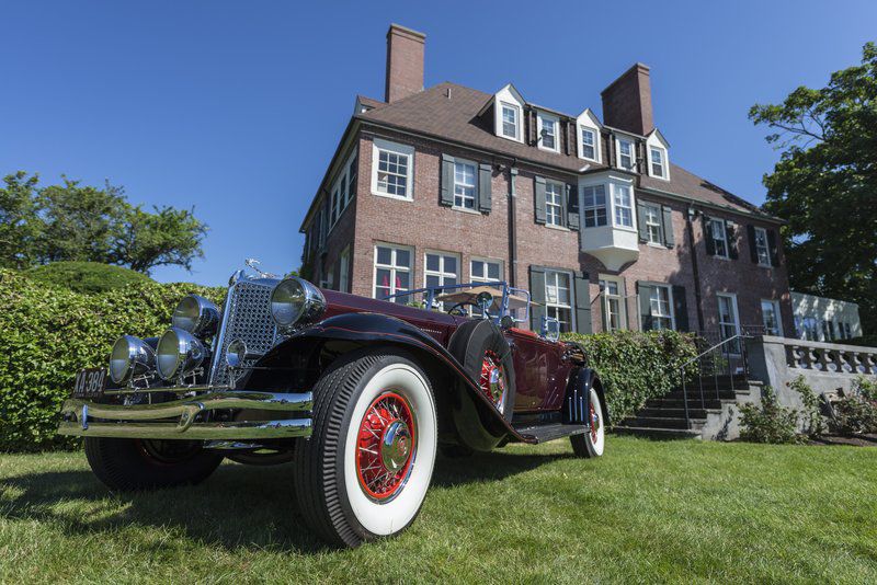 Automotive elegance, then and now; Antique and luxury car show rolling