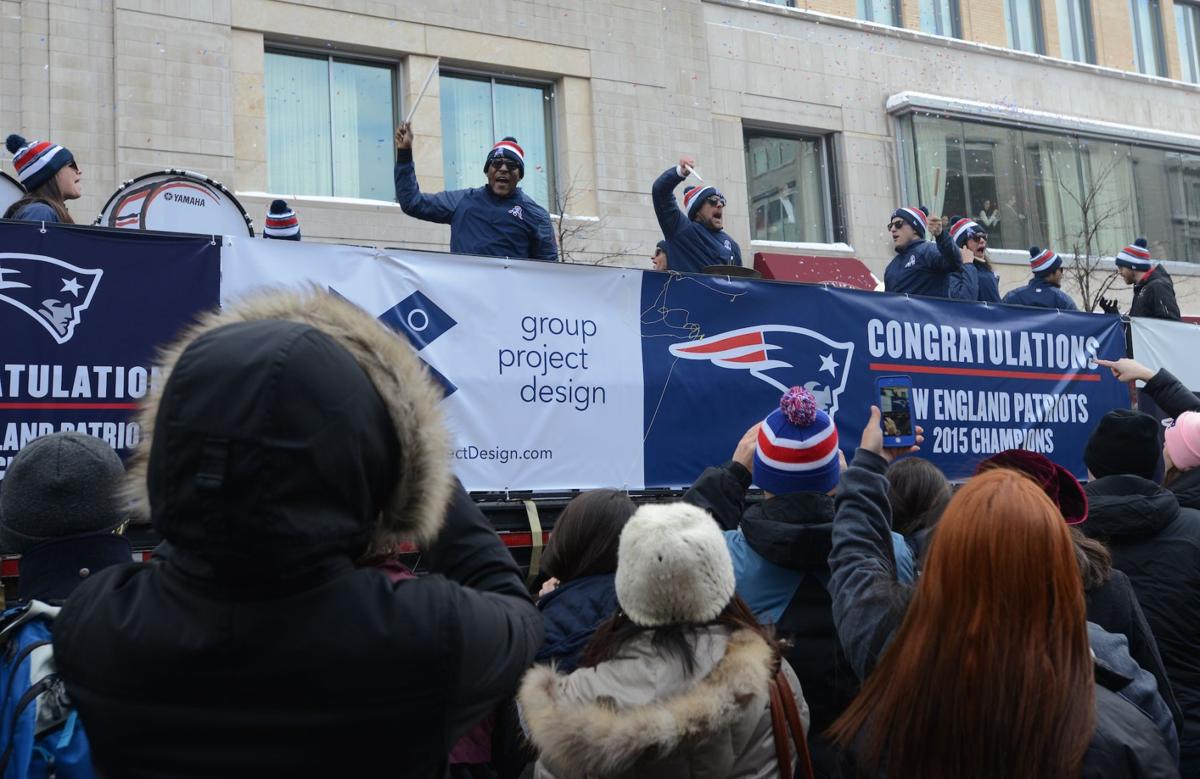 The first float down Boylston Street holds a band that pumped up the crowd as the team's celebratory parade got underway.