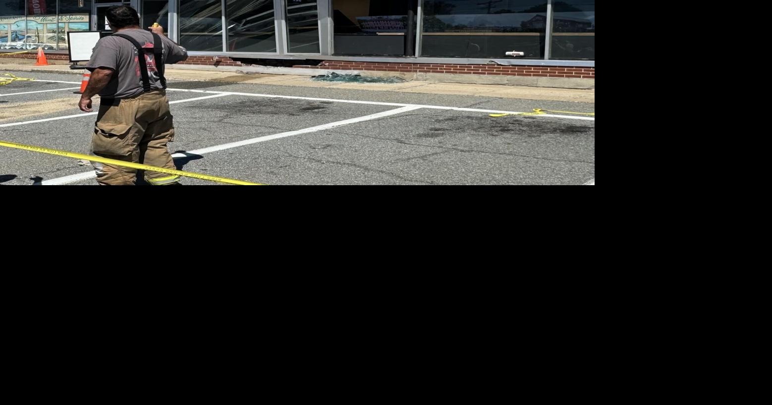 Driver taken to hospital after crashing into building
