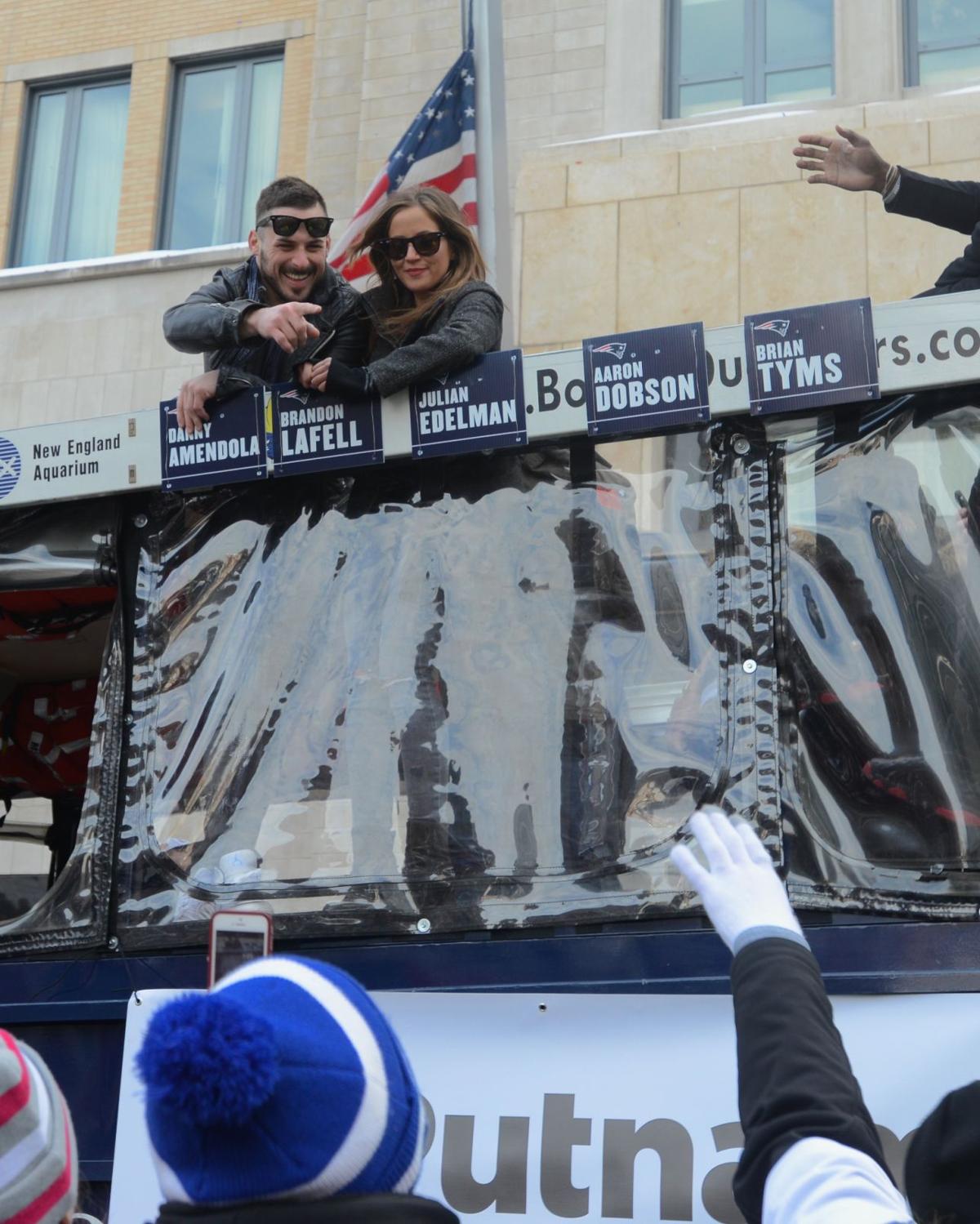 Patriots Wide Receiver Danny Amendola points to fans along Boylston Street during the team's celebratory parade.