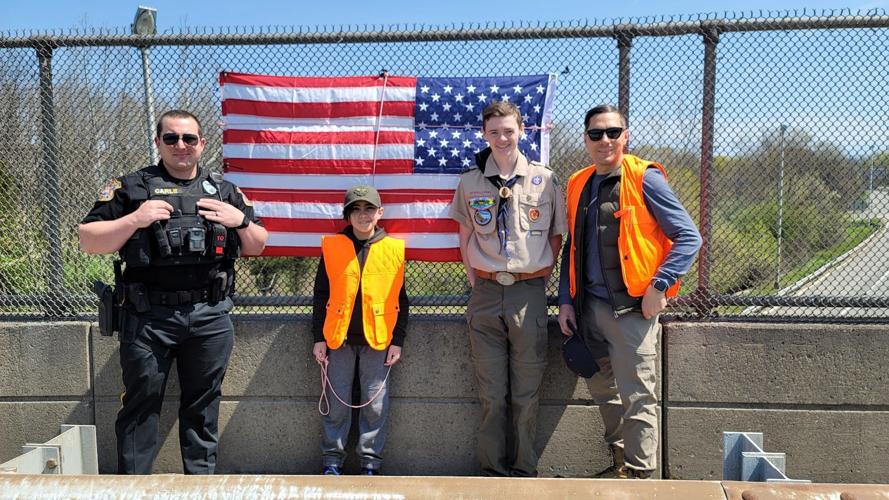 Lebanon Boy Scout Troop 200 helps replaces flags on Clinton Township overpasses