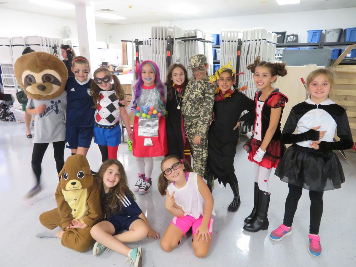 participating in girl scout troop 6176s halloween blast at randolph middle school on friday oct 20 are front row from left brooke baidwan