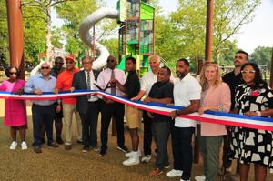 Modernized playground equipment at Monte Irvin Orange Park in Orange, New Jersey with new apparatus and rubberized safety surface