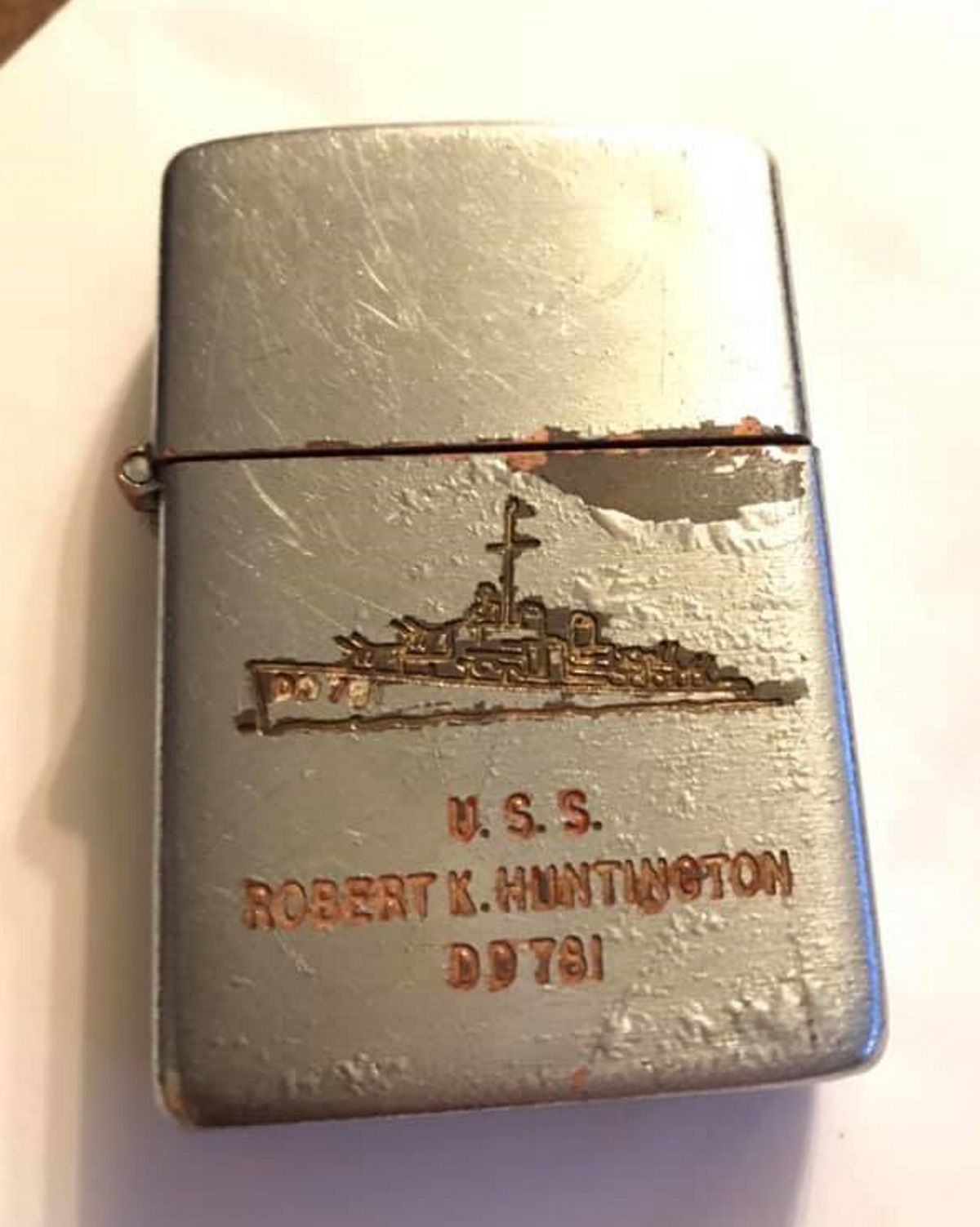 Mystery grows after discovery of Korean War era Zippo in Budd Lake