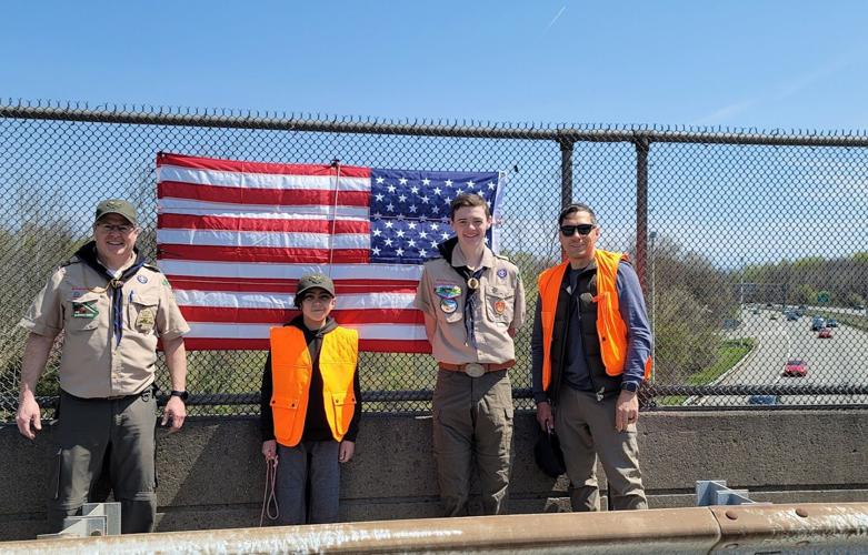 Lebanon Boy Scout Troop 200 helps replaces flags on Clinton Township overpasses