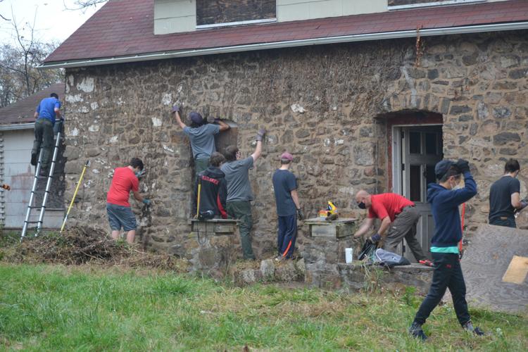 Boy Scouts clean up 1755 Gitlow farmhouse at Windy Acres