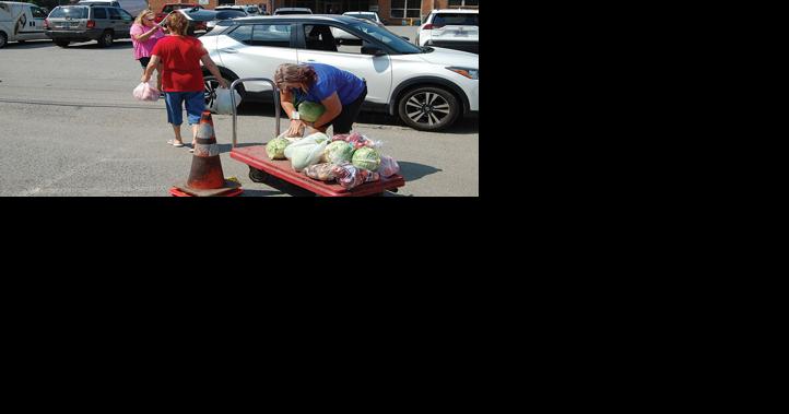 Area residents recipients of produce giveaway - Vimarsana News